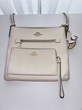 Coach White Pebbled Leather Crossbody with matching wristlet.